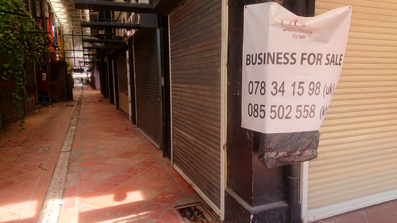 Business for sale, a familiar sign in the town. Many businesses are closed indefinitely, or on sale. Pub Street, Siem Reap